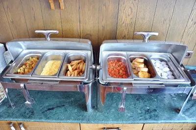 two trays of food sitting on top of a table at Hotel Centrum Istanbul in Istanbul