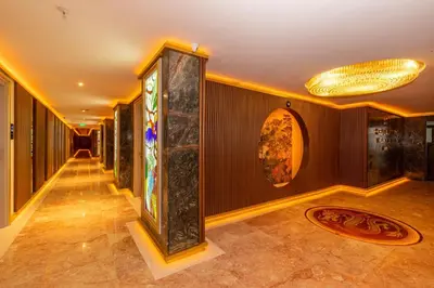 a hallway of a hotel with a chandelier at Wyndham Istanbul Old City in Istanbul