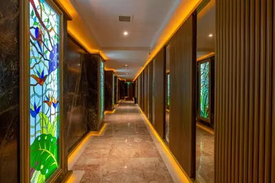 a hallway with stained glass windows in a building at Wyndham Istanbul Old City in Istanbul