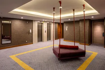a lobby with a bed in the middle of a room at Holiday Inn Sisli by IHG in Istanbul