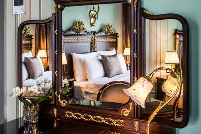 a mirror in a bedroom with a bed in it at Bosphorus Palace Hotel in Istanbul