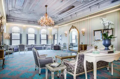 a large lobby with chairs and a chandelier at Bosphorus Palace Hotel in Istanbul