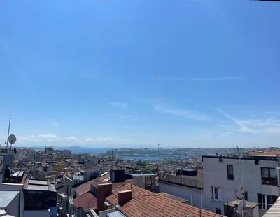 a view of a city with buildings and mountains at Misafir Suites 8 Istanbul in Istanbul