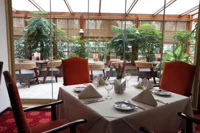 a dining room with a table and chairs and a table and chairsktop at Güneş Hotel Merter in Istanbul