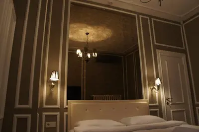 a bedroom with a bed and a large mirror at Triada Hotel Taksim - Special Category in Istanbul