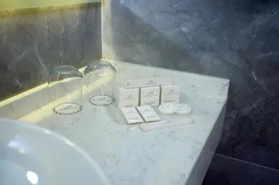 a bathroom with a sink and a marble counter top at Hotel Bulvar Palas in Istanbul