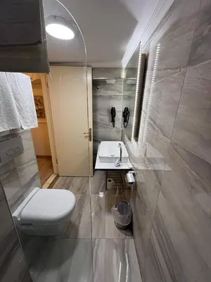 a bathroom with a toilet and a sink at The Constantine Hotel in Istanbul