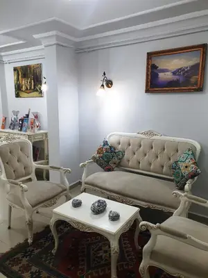a living room with a couch and two chairs and a table at Oceans 7 Hotel in Istanbul