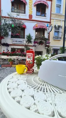 a table with a cup of coke on top of it at Oceans 7 Hotel in Istanbul