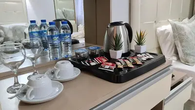 a table with a tray of food and water bottles at Oceans 7 Hotel in Istanbul