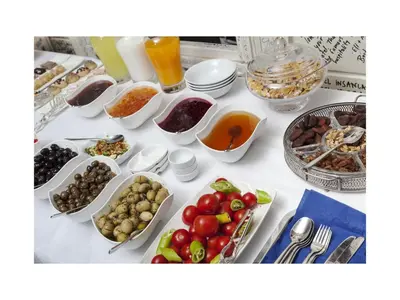 a table filled with different types of food at Hotel Troya Balat in Istanbul