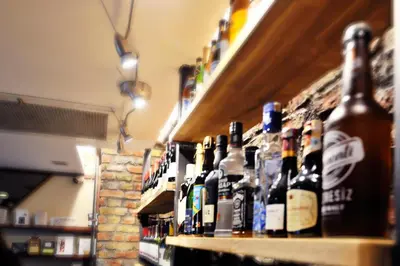 a row of bottles of alcohol on a shelf at Parkhouse Hotel & Spa in Istanbul