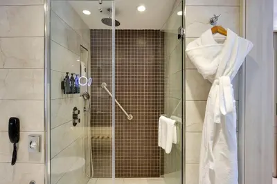 a bathroom with a shower with a glass door at Ramada by Wyndham Istanbul Old City in Istanbul