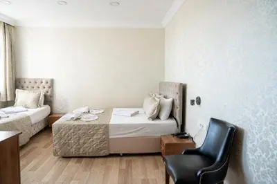 a hotel room with a bed and a chair at Angels Garden Hotel - Special Catagory in Istanbul