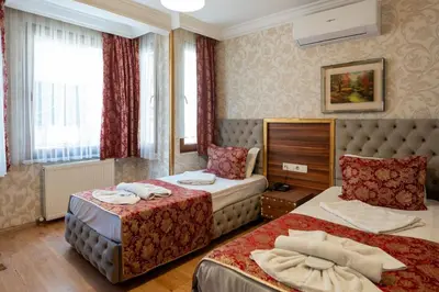 a hotel room with two beds in a room at Angels Garden Hotel - Special Catagory in Istanbul