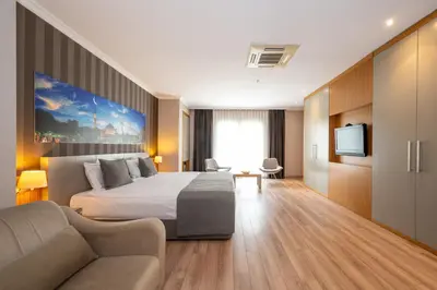 a hotel room with a bed and a couch at Klas Hotel Istanbul Old City in Istanbul