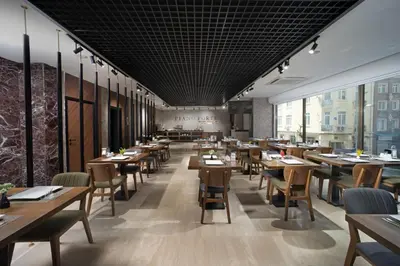a dining room with wooden tables and chairs at Pianoforte by Febor Hotels&Spa in Istanbul
