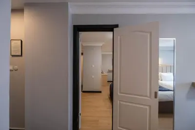 a door leading to a bedroom with a bed at Berr Hotel in Istanbul