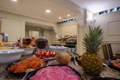 a buffet of food on a table with fruits and vegetables at Berr Hotel in Istanbul