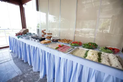 a long table with food on top at Buyukada Comfort OTEL in Buyukada