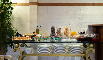a table with plates of food and glasses on it at Valide Sultan Konagi in Istanbul