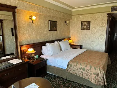 a hotel room with a bed and a table and a desk at Germir Palas Hotel - Special Class in Istanbul
