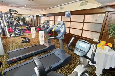 a gym with two tread machines and a treadmill at Germir Palas Hotel - Special Class in Istanbul