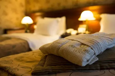 a hotel room with two beds and a towel at Germir Palas Hotel - Special Class in Istanbul