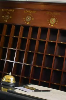 a wooden wine cellar with a shelf of wine bottles at Germir Palas Hotel - Special Class in Istanbul