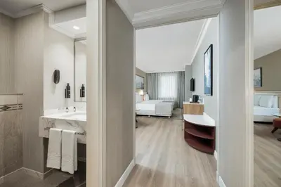 a bathroom with a sink and a large mirror at Elite World Comfy Istanbul Taksim in Istanbul