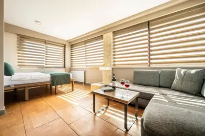a living room with a couch and a table at The Pera Hotel in Istanbul