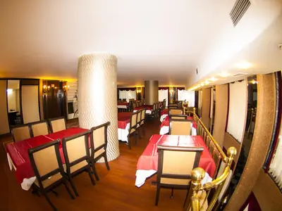 a row of tables and chairs in a restaurant at Tayhan Hotel in Istanbul