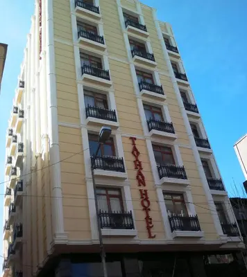 a yellow building with balconies on the side of it at Tayhan Hotel in Istanbul