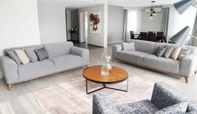 a living room with two couches and a table at The Marmara Suadiye Residence in Istanbul