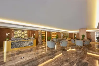 a hotel lobby with chairs and a bar at Grand Hotel Gulsoy Old City in Istanbul