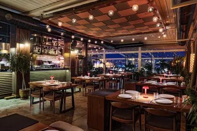 a restaurant with tables and chairs and a bar at Grand Hotel Gulsoy Old City in Istanbul