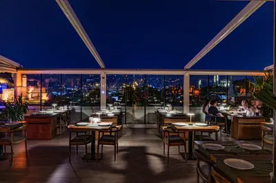 a restaurant with a view of the city at night at Grand Hotel Gulsoy Old City in Istanbul