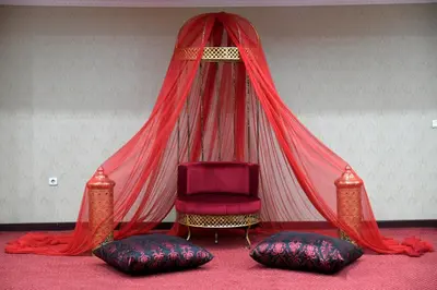 a room with a tent with a chair and pillows at Grand Halic Goldenhorn in Istanbul