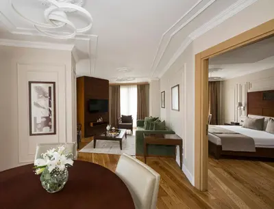 a living room with a bed and a dining room at Continental Hotel Pera in Istanbul