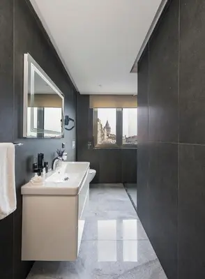 a bathroom with a white sink and a mirror at Continental Hotel Pera in Istanbul