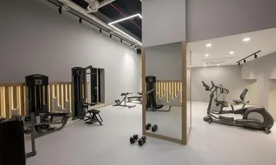 a gym with several exercise bikes and a mirror at Continental Hotel Pera in Istanbul