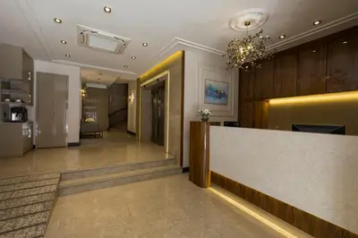 a lobby of a hotel with a reception counter at Continental Hotel Pera in Istanbul
