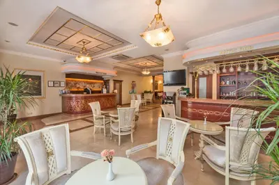a restaurant with tables and chairs and a bar at Antis Hotel-Special Category in Istanbul