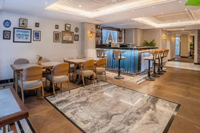 a restaurant with tables and chairs and a bar at Grand Hilarium Hotel in Istanbul
