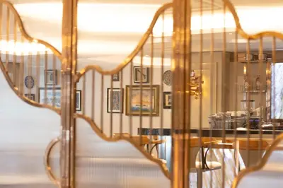 a dining room with a table and a mirror at Grand Hilarium Hotel in Istanbul