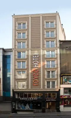 a large building with a hotel sign on it at Royce Hotel in Istanbul