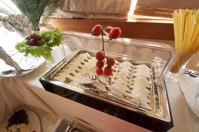 a tray of food with cherries on top of it at Royce Hotel in Istanbul
