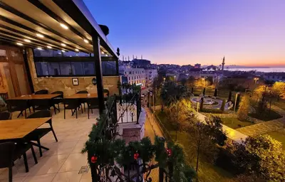 a balcony with a view of a city at night at Saruhan Hotel in Istanbul