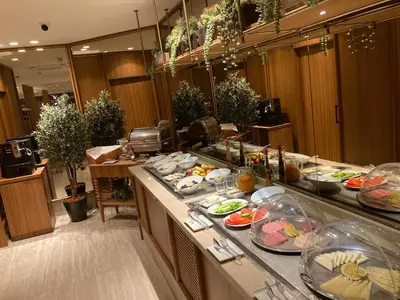 a buffet line with plates of food in a restaurant at Housez Suites & Apartments Special Class in Istanbul
