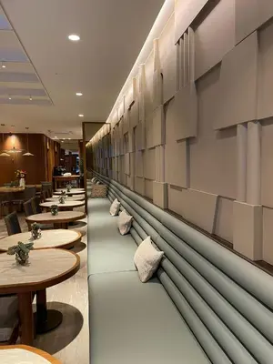 a row of tables and benches in a restaurant at Housez Suites & Apartments Special Class in Istanbul